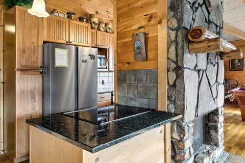 Full size refrigerator, cooking utensils, pots, pans and grilling utensils. 