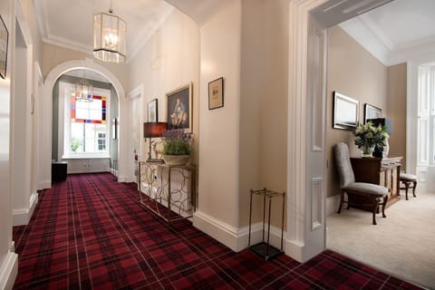 The Linen House - impressive first floor hallway with grand proportions and stunning architrave mouldings and cornicing