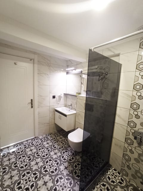Separate tub and shower, jetted tub, hair dryer, slippers