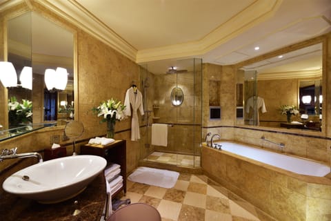 Separate tub and shower, designer toiletries, hair dryer, bathrobes