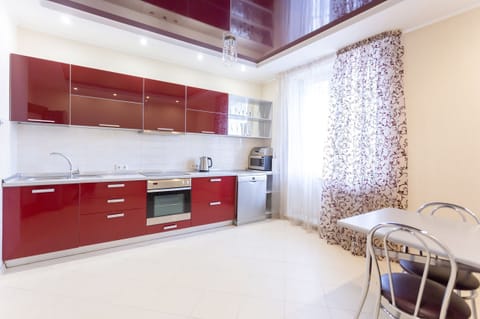 Comfort Apartment | Private kitchen | Full-size fridge, microwave, oven, stovetop