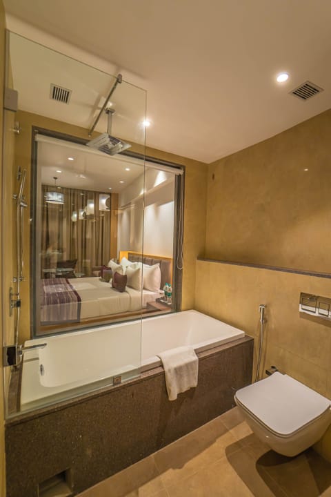 Fern Club Room With Bathtub | Bathroom | Separate tub and shower, rainfall showerhead, free toiletries