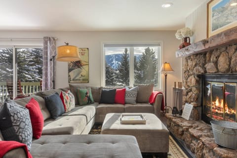 Gather round the wood burning fireplace on large comfy sectional!