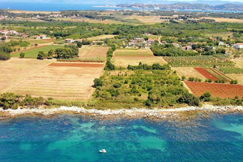 The aerial overview of the rocky coast of Zambratija