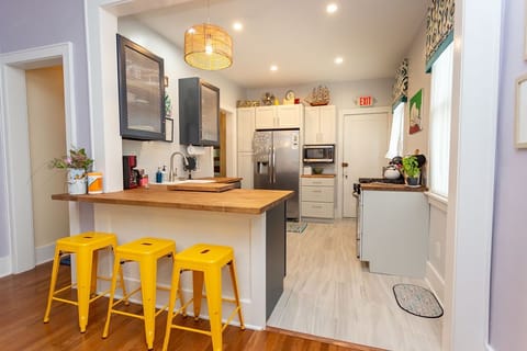 The kitchen has a peninsula with counter seating. Great for visiting the chef!