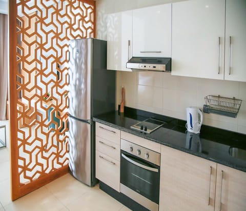 Studio, 1 Bedroom | Private kitchen | Full-size fridge, stovetop, electric kettle, cookware/dishes/utensils