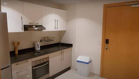 Studio, 1 Bedroom | Private kitchen | Full-size fridge, stovetop, electric kettle, cookware/dishes/utensils