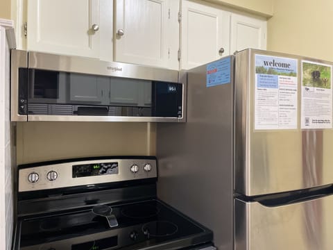 Fully-stocked kitchen with all-new stainless steel appliances and cookware.