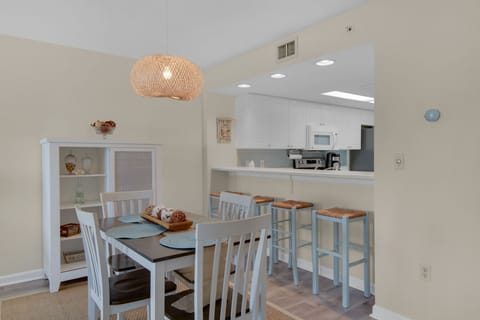 dining area and eat-in bar. Seating for 8