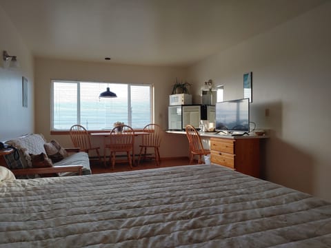 Suite, 1 King Bed with Sofa bed, Ocean View (Adults only) | Living area | 32-inch TV with satellite channels