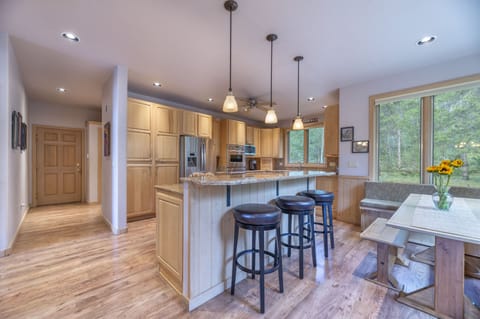 Breakfast bar island and bench seating in the Kitchen.