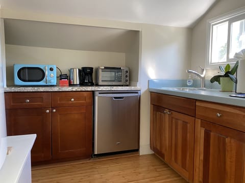 dishes ,silverware, microwave,oven, coffee maker, dishwasher hot water kettle