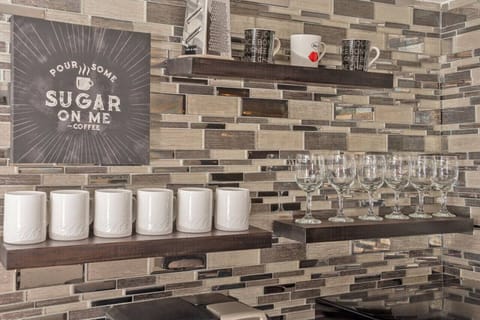 Pour some sugar on your mornings! This chic coffee nook comes stocked with all the essentials for a perfect brew.