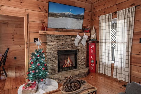 Relax by the fire with festive holiday decor.