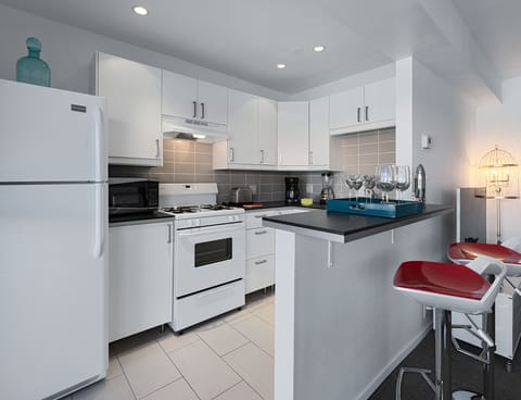 Deluxe Room, 1 King Bed | Private kitchen | Full-size fridge, oven, stovetop, espresso maker