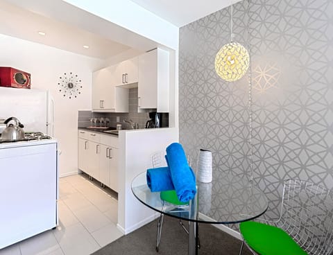 Deluxe Room, 1 King Bed | Private kitchen | Full-size fridge, oven, stovetop, espresso maker