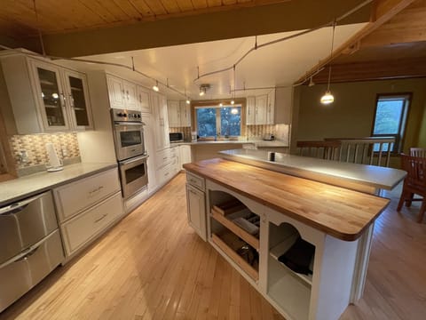 Stocked kitchen with silverware and basic necessities 