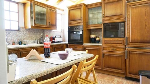 Comfort Apartment | Private kitchen | Full-size fridge, microwave, oven, stovetop