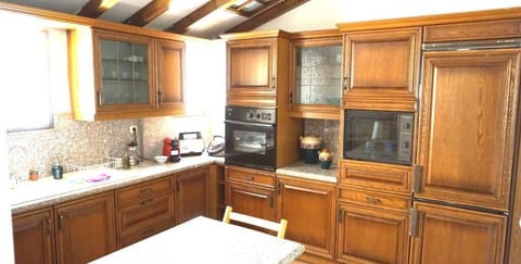 Comfort Apartment | Private kitchen | Full-size fridge, microwave, oven, stovetop