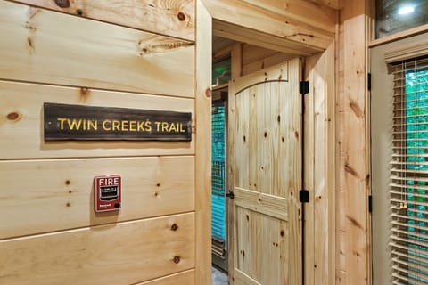 Upstairs room, queen over queen bunk beds and walk in shower en suite bathroom.  Each room has deck access too!