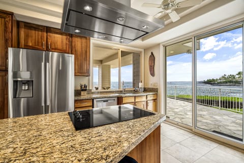 Stainless steel appliances and granite countertops elevate every cooking experience.
