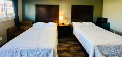 Room, 2 Double Beds | Premium bedding, iron/ironing board, free WiFi