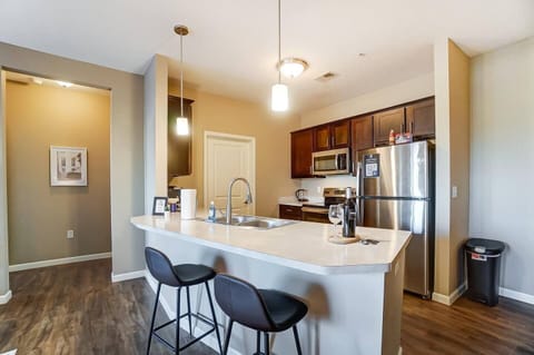 Modern kitchen with plenty of counter space and tons of kitchenware. We include not only the basics, but tons of extras...2 types of coffee makers (Keurig + drip), crock pot, blender, toaster, knife set...and of course, all the basics like silverware