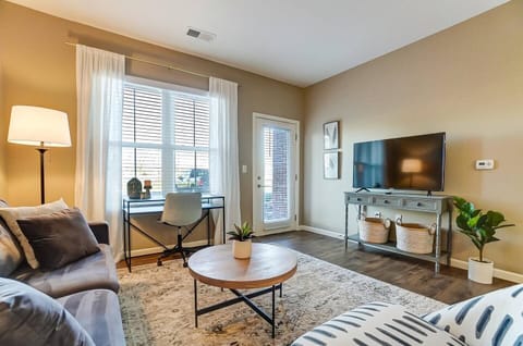 Spacious living room w/50" Smart Roku TV, office desk + chair, and spacious private patio!