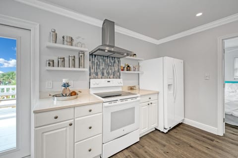 2nd fl main living open concept, kitchen & dining. Front & back balcony access. 