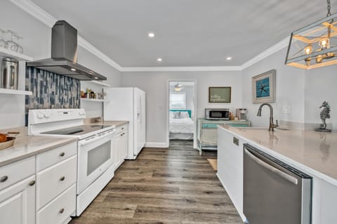 2nd fl main living open concept, kitchen & dining. Front & back balcony access. 