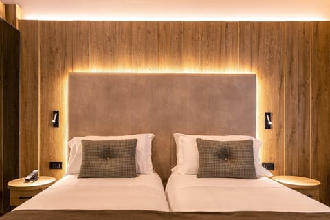 Family Room | Premium bedding, down comforters, minibar, in-room safe