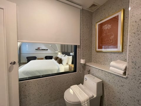 Cozy Suite | Bathroom | Shower, hair dryer, towels, soap