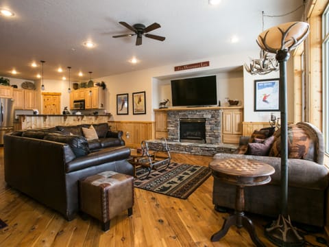 Living room with Huge Smart TV and  Sonos sound system.
