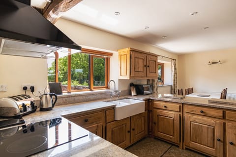 Oak kitchen cupboards with an under counted fridge & separate freezer