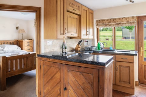 Coach House kitchen leading to the outdoor garden & optional Salt water hot tub