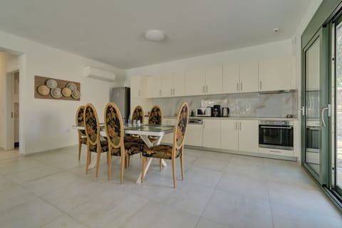 Villa | Private kitchen | Full-size fridge, microwave, oven, stovetop
