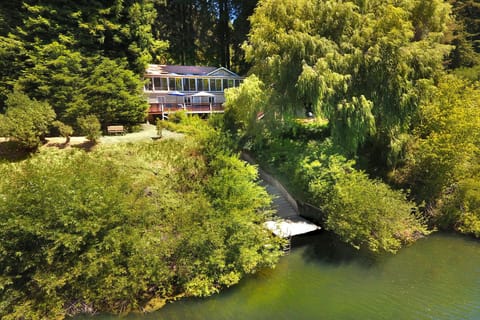 Rear of home facing the Russian River with stairs leading to seasonal dock.