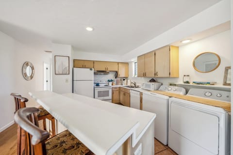 Kitchen with a full washer and dryer