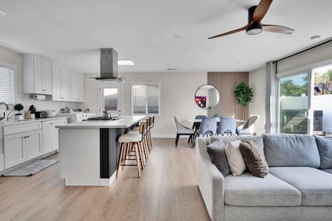 Open-concept living area with seamless flow from kitchen to dining area.