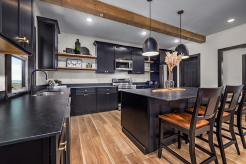 Gourmet kitchen with stainless appliances.