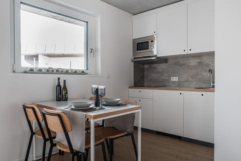 Design Apartment, 1 King Bed | Private kitchen | Fridge, microwave, stovetop, electric kettle