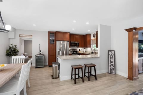 The kitchen is stocked with a full set of appliances, including a Keurig and basic kitchen utensils and seating at the bar for 2. 