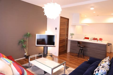 Deluxe Apartment, Non Smoking | Living area | Flat-screen TV, fireplace