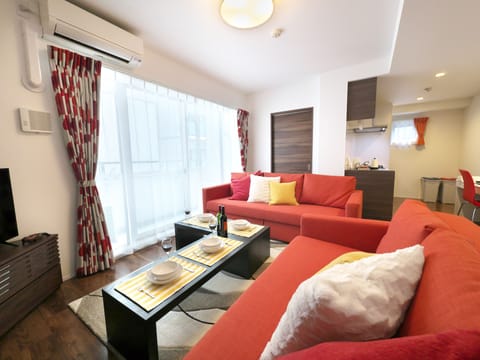 Luxury Apartment, Non Smoking | Living area | Flat-screen TV, fireplace