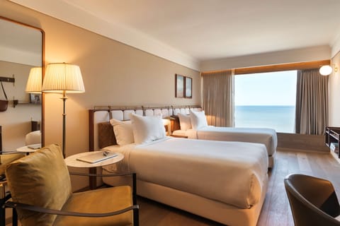 Deluxe Room, 2 Twin Beds, Sea View | Minibar, in-room safe, desk, blackout drapes