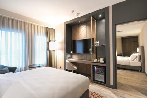 Junior Suite, Multiple Beds, Non Smoking | Minibar, in-room safe, desk, laptop workspace