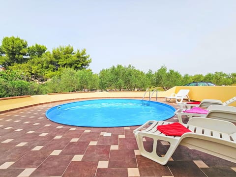 Water, Sky, Property, Swimming Pool, Azure, Tree, Outdoor Furniture, Leisure, Plant, Grass