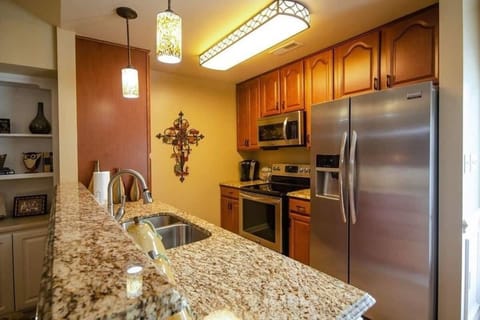 Kitchen is fully stocked with dishes and small appliances.