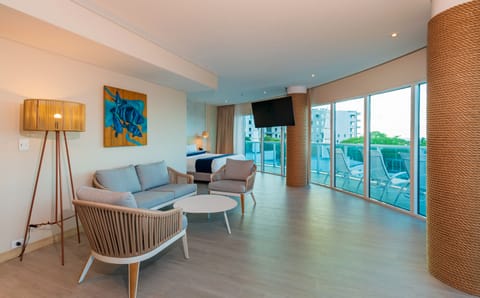 Suite, Balcony | Living area | 30-inch TV with cable channels