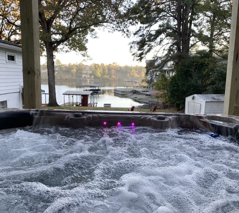 Hot tub sitting with a Lake Hamilton View